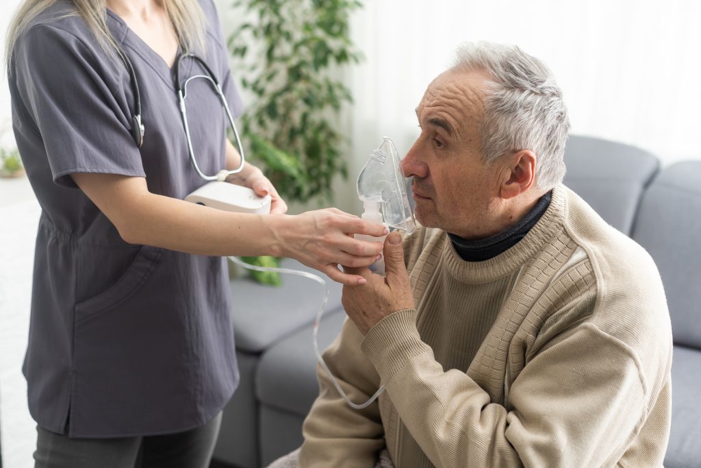 Elderly Senior Man nursing care wear oxygen inhaler device for helping breath respiratory. Oxygen Concentrator portable
